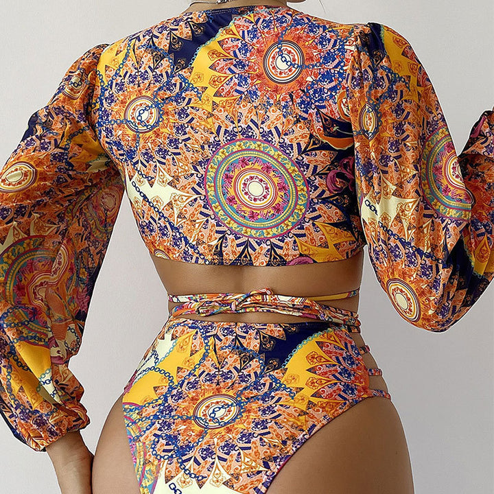 Women's bikini set with long-sleeved top and intricate cut-outs