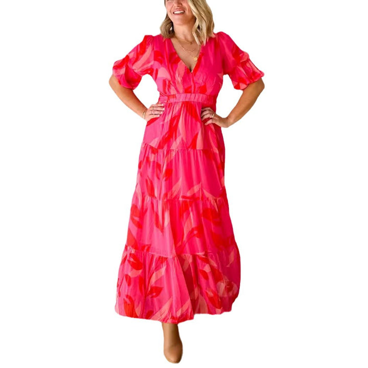 Ladies' flared maxi dress with V-neck, elastic underbust seam, and tiered skirt StylebySassy