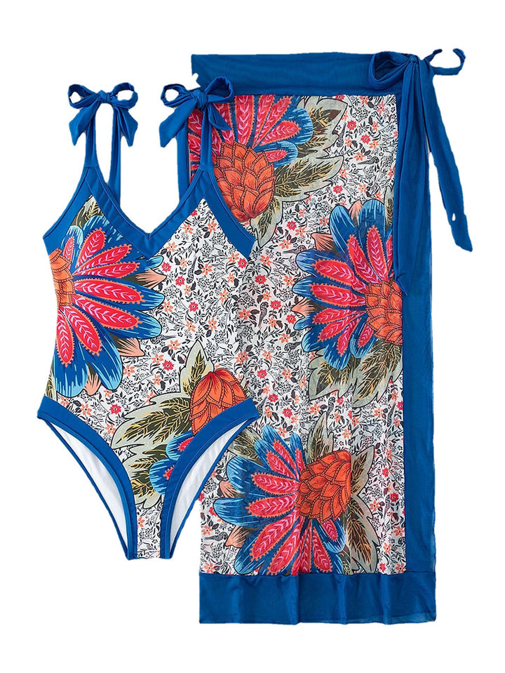 Women's one-piece swimsuit with playful floral design and stylish wrap skirt StylebySassy