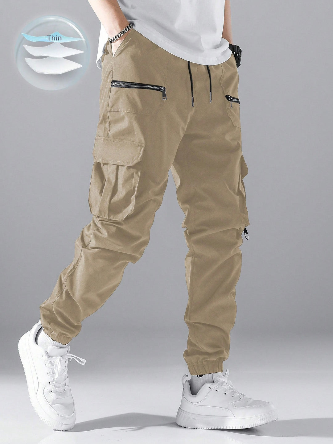 Men's slim cargo joggers with multiple zippered pockets, elastic ankle cuff, and drawstring StylebySassy