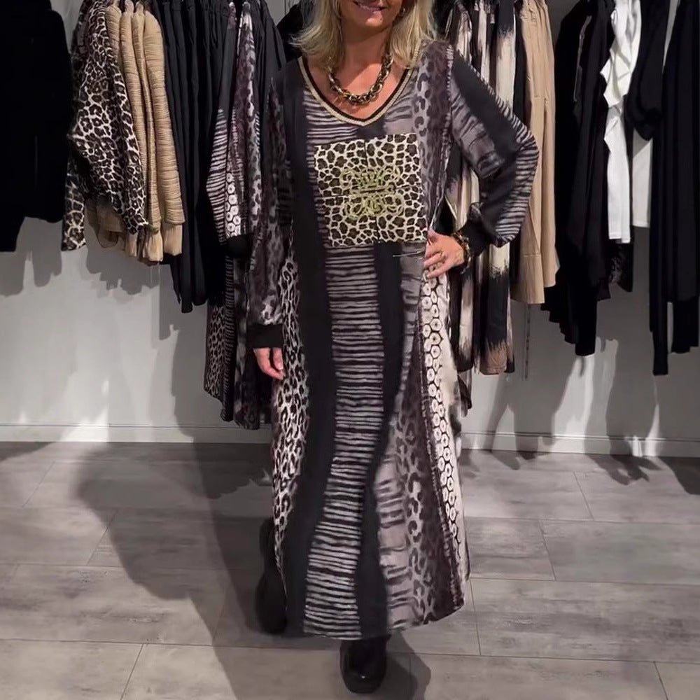 Ladies flowing panel long dress with patchwork animal print and gold-colored chest application StylebySassy