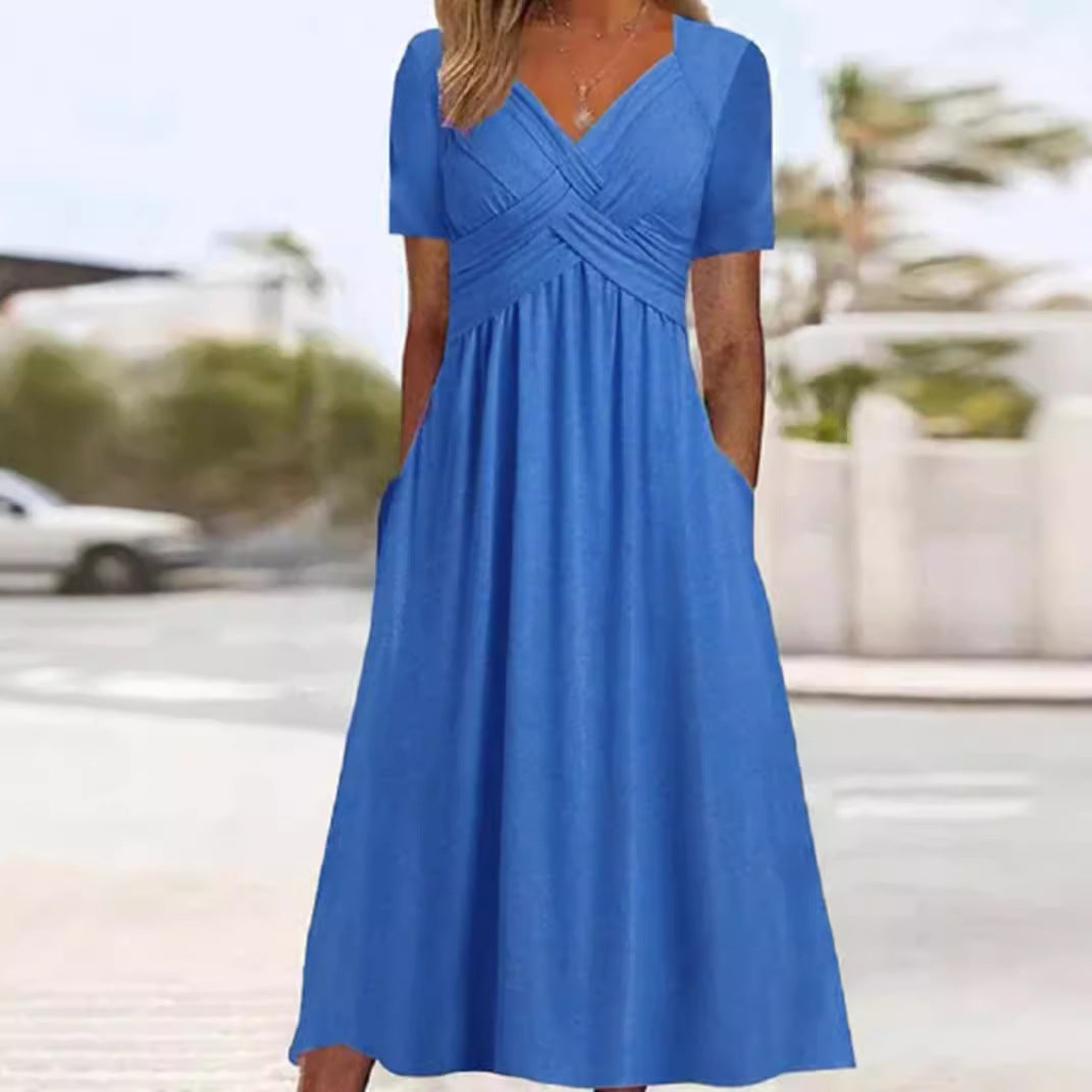Women's airy midi dress with V-neck, wrap look, empire waist, and pockets StylebySassy