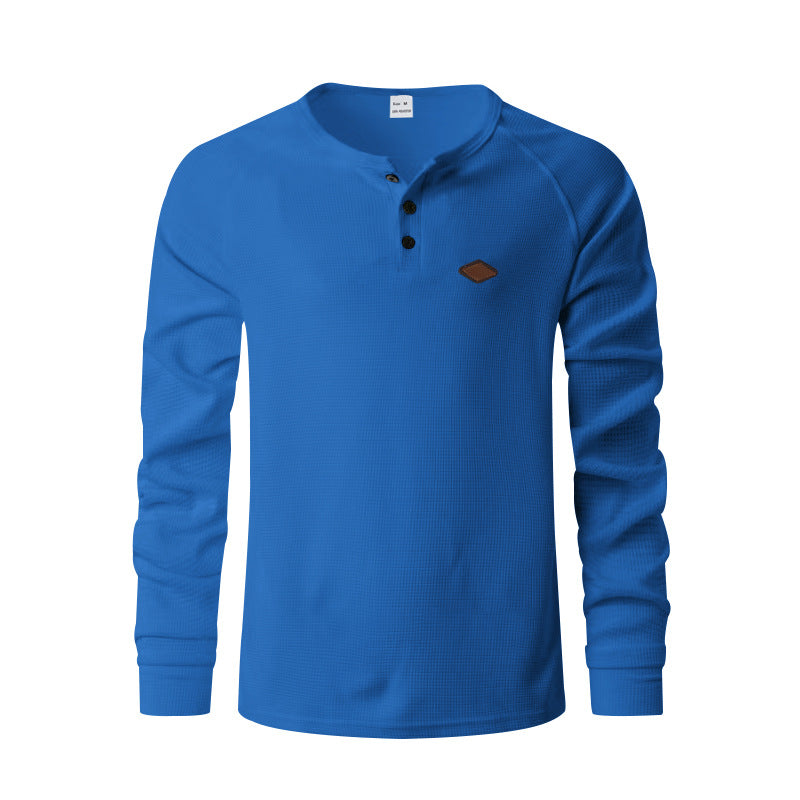 Men's structured long-sleeve shirt with short button placket, raglan sleeves, and subtle logo application StylebySassy