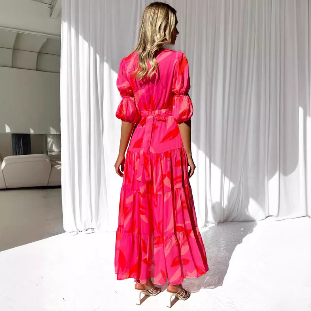 Ladies' flared maxi dress with V-neck, elastic underbust seam, and tiered skirt StylebySassy