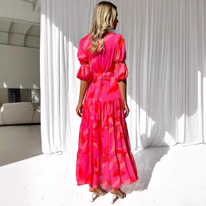 Ladies' flared maxi dress with V-neck, elastic underbust seam, and tiered skirt StylebySassy