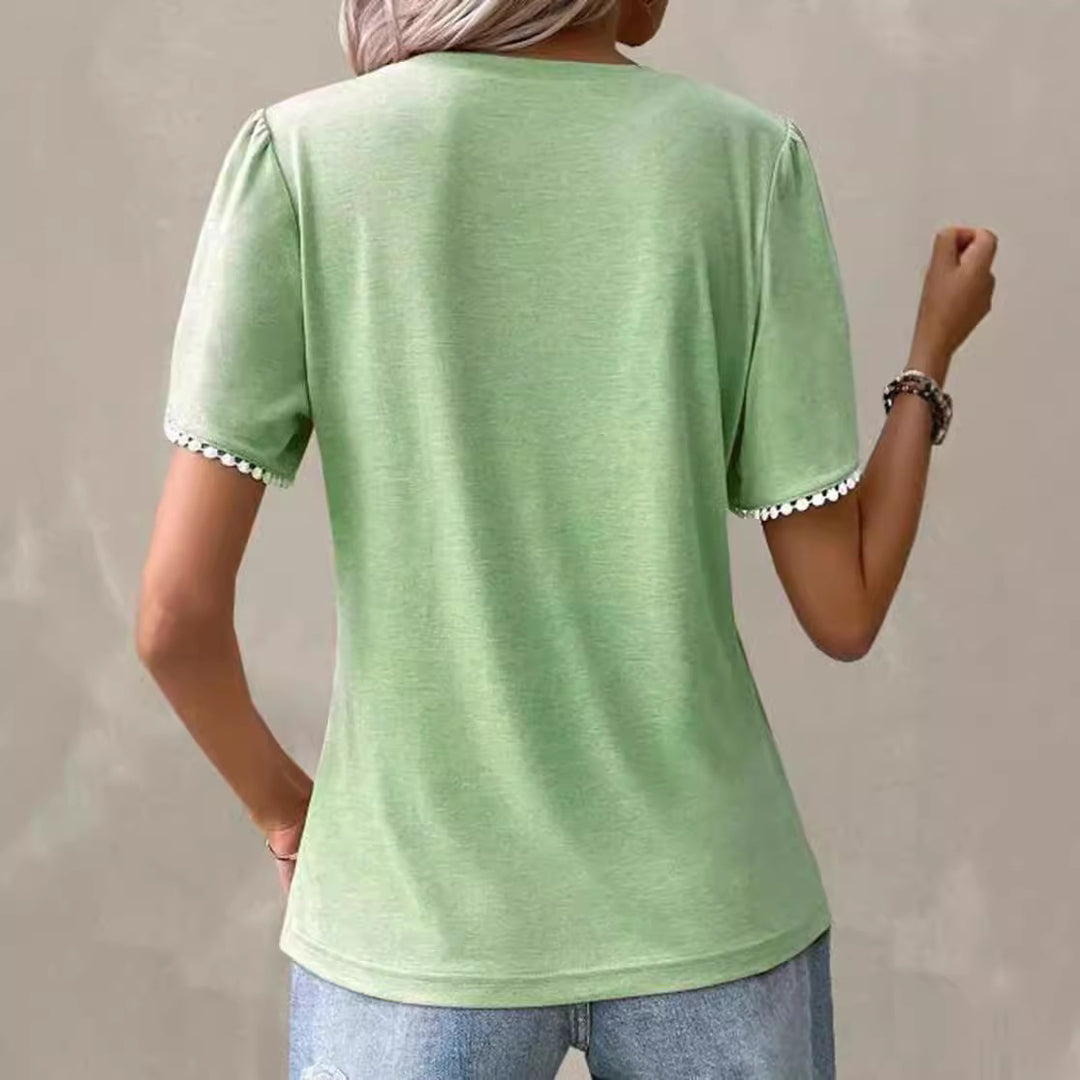 Women's round neck shirt with decorative pleated front, flutter sleeves and pompom trim StylebySassy