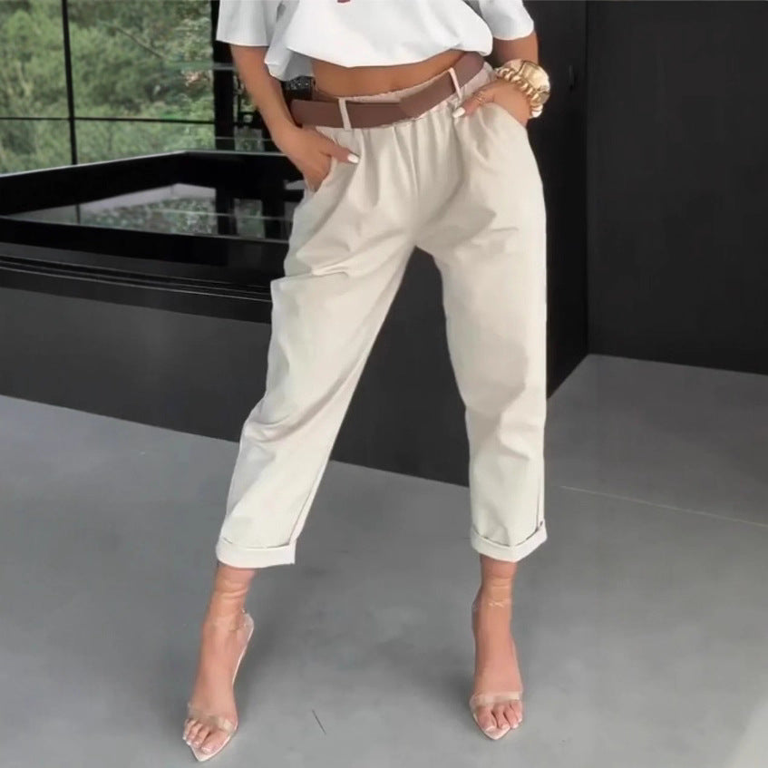 Women's high-waisted paperbag pants with gathered waistband, side pockets, and rolled hem StylebySassy