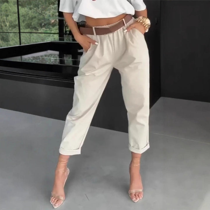 Women's high-waisted paperbag pants with gathered waistband, side pockets, and rolled hem StylebySassy