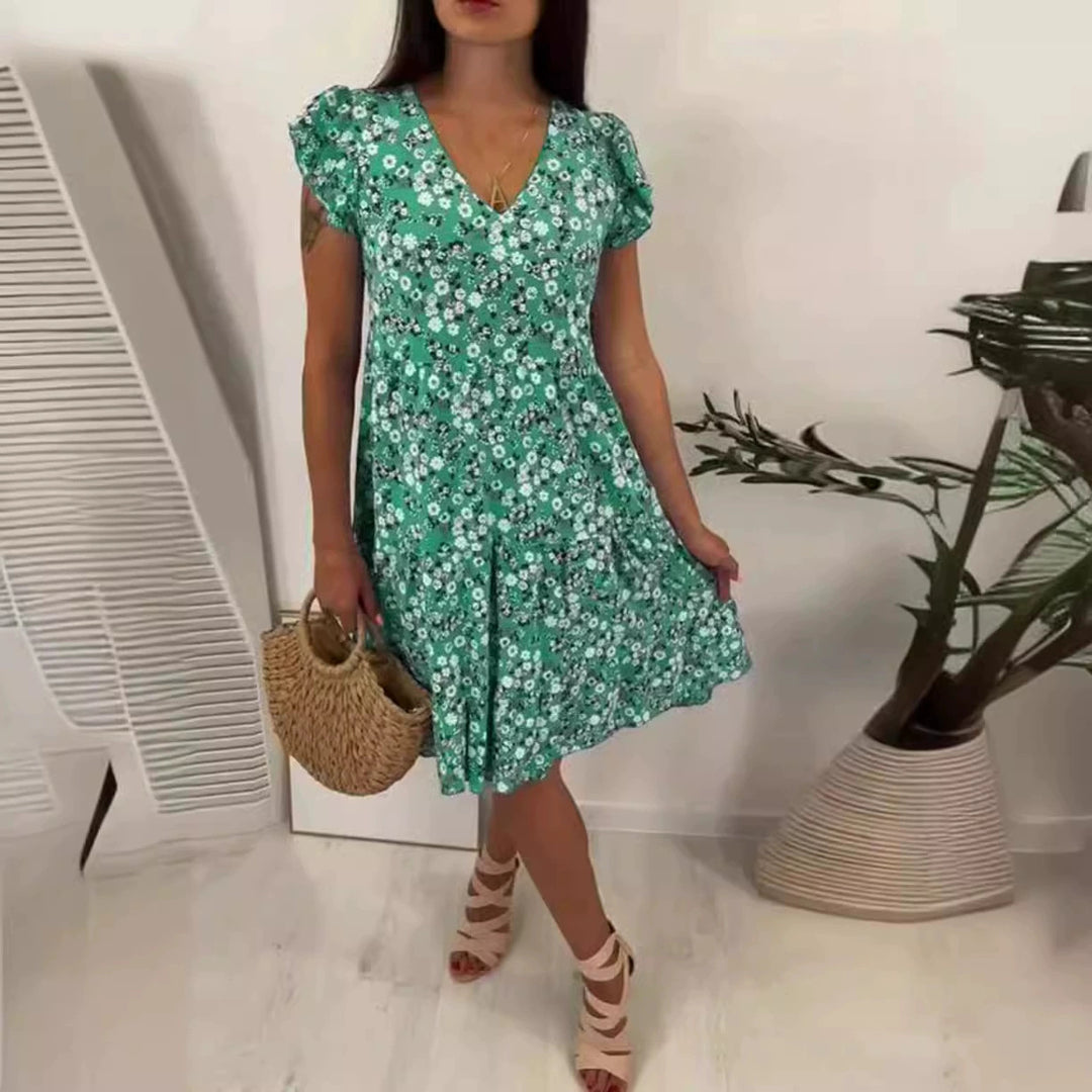 Women’s V-neck dress with gathered waist seam, short flounce sleeves, and tiered skirt StylebySassy