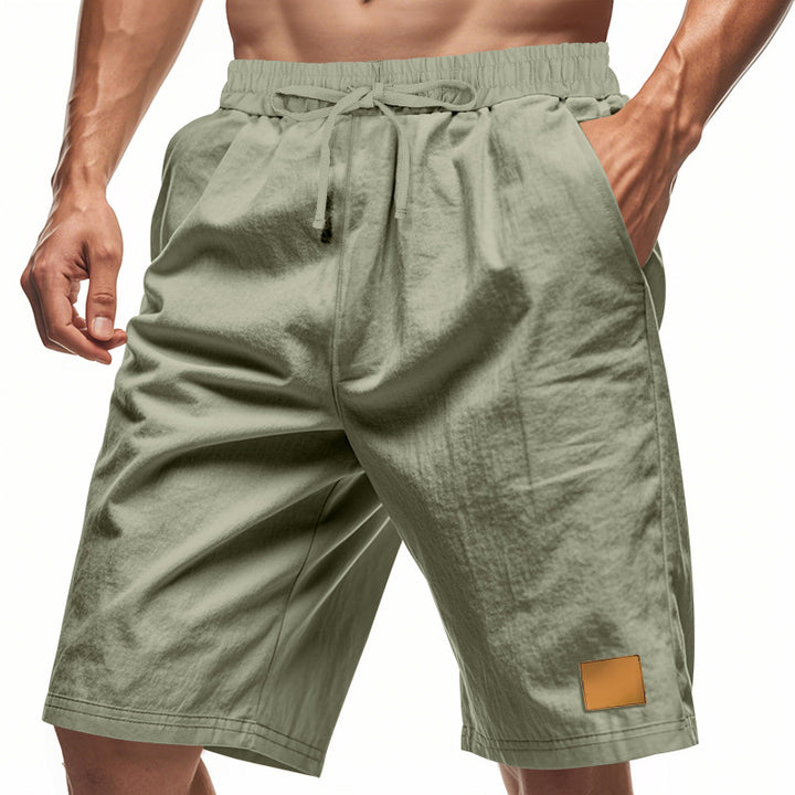 Men's drawstring Bermuda shorts made of soft cotton blend with elastic waistband and side pockets StylebySassy