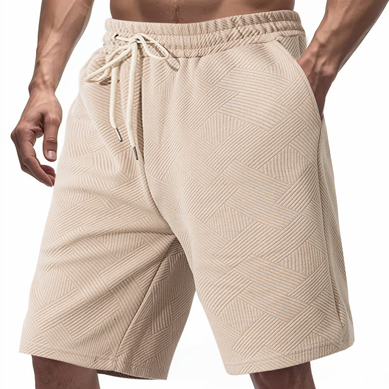 Men's knee-length textured swim shorts with elastic drawstring waistband and side pockets StylebySassy
