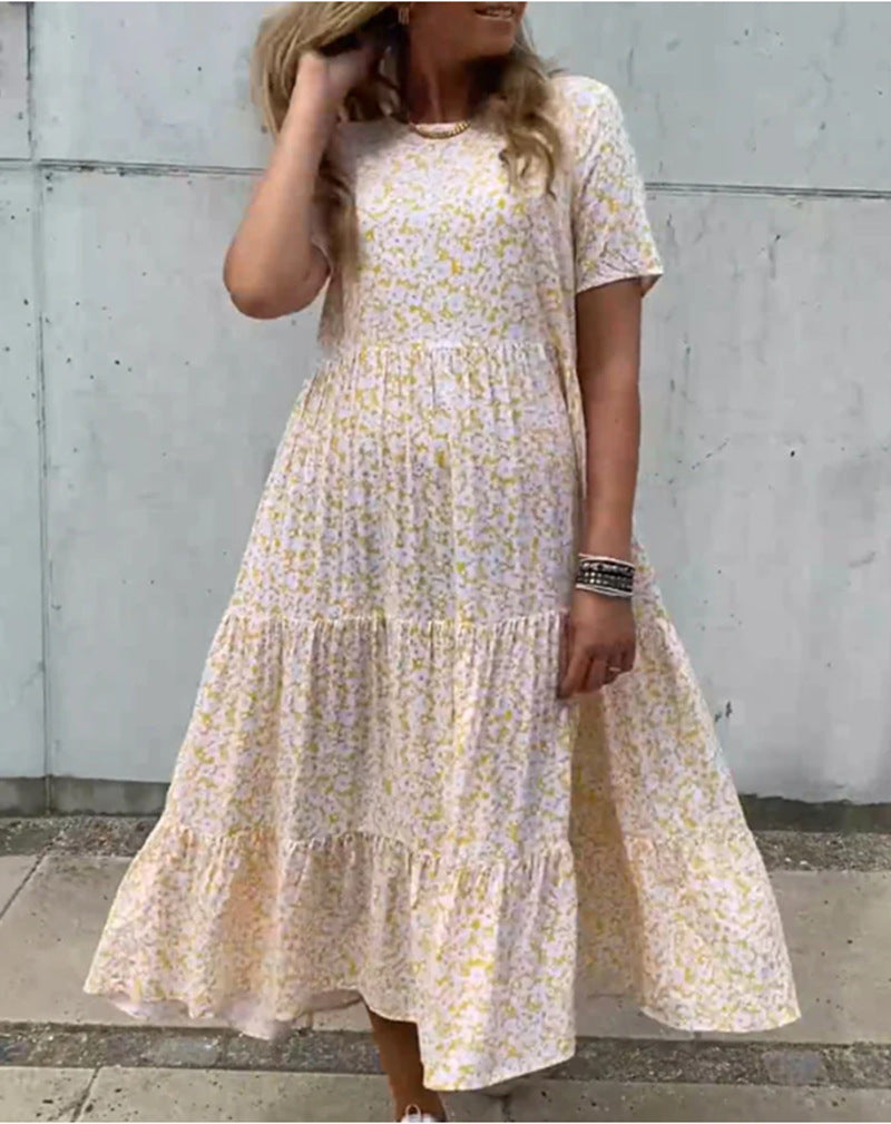 Women's flowing tiered maxi dress in Boho babydoll style with gathered underbust and short sleeves StylebySassy