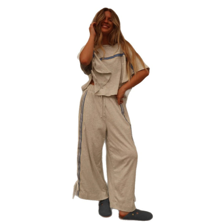 Ladies two-piece leisure ensemble with boxy ruffle top and wide cord pants with side decorative stripe StylebySassy