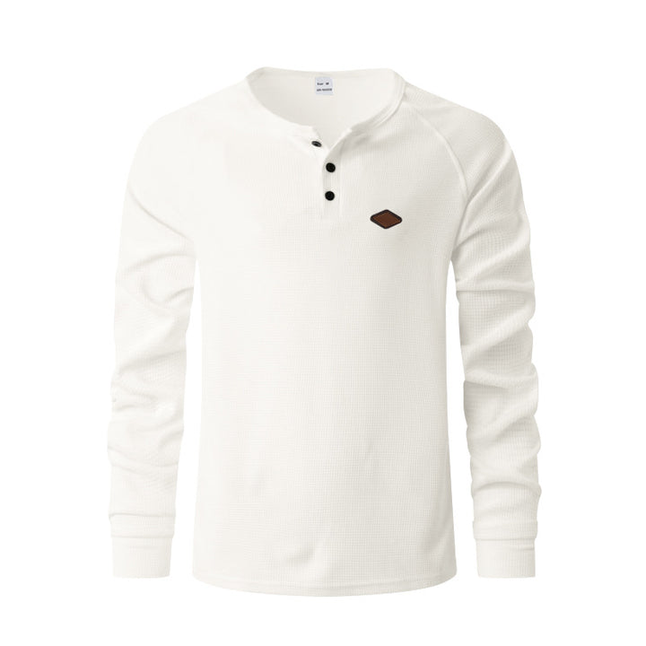 Men's structured long-sleeve shirt with short button placket, raglan sleeves, and subtle logo application StylebySassy