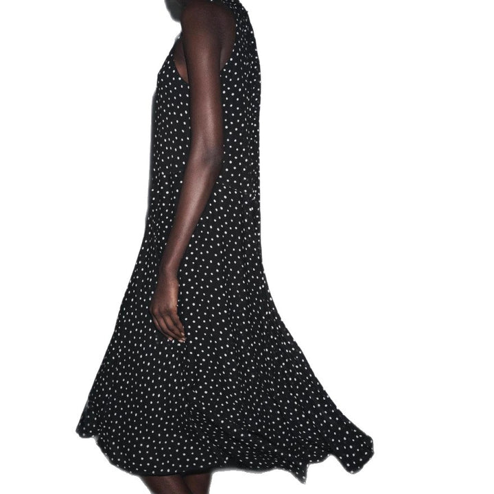 Women’s sleeveless high-neck midi dress with swinging flounce skirt and feminine A-line StylebySassy