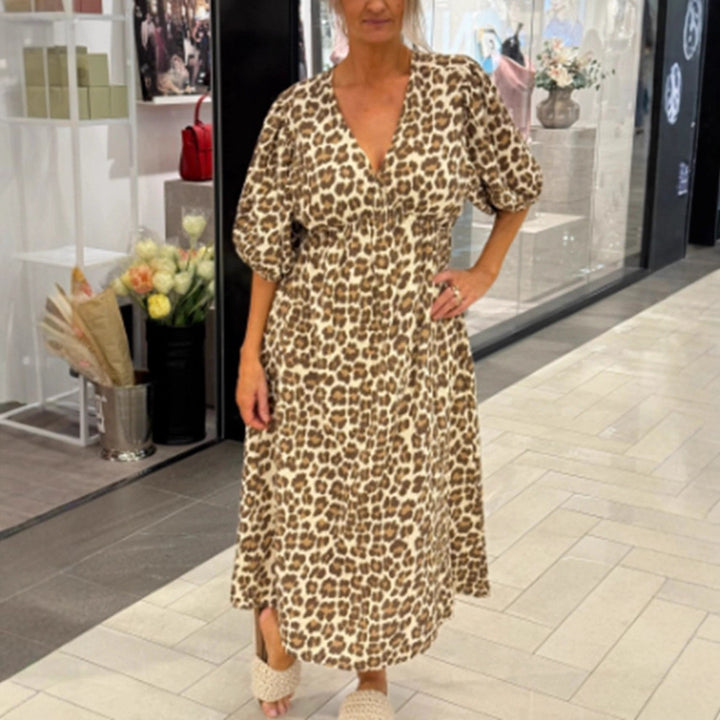 Women's maxi dress with deep V-neck, voluminous puff sleeves, and smocked waist seam StylebySassy