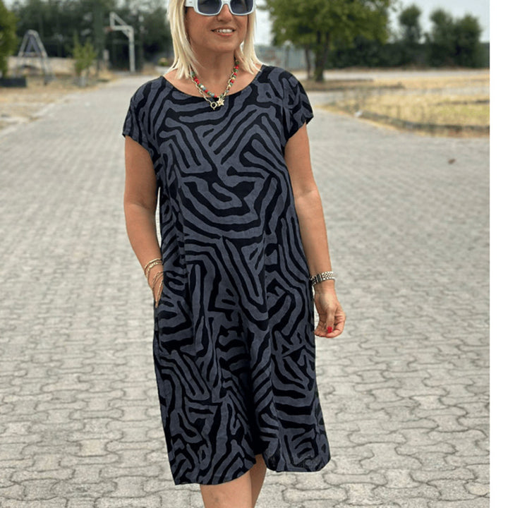 Women knee-length A-line midi dress with textured jacquard look and round neckline StylebySassy