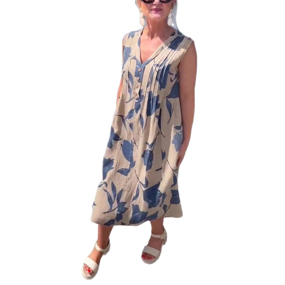 Women's sleeveless A-line midi dress with V-neck, bust pleats, button placket, and large floral print StylebySassy