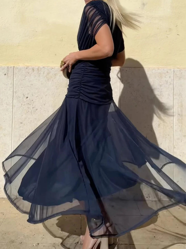 Ladies elegant floor-length evening dress with draped shoulder area and airy chiffon skirt StylebySassy