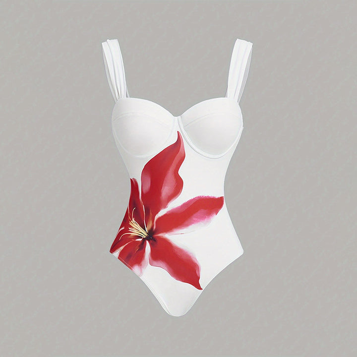 Women's one-piece swimsuit with elegant flower appliqué and draped skirt StylebySassy