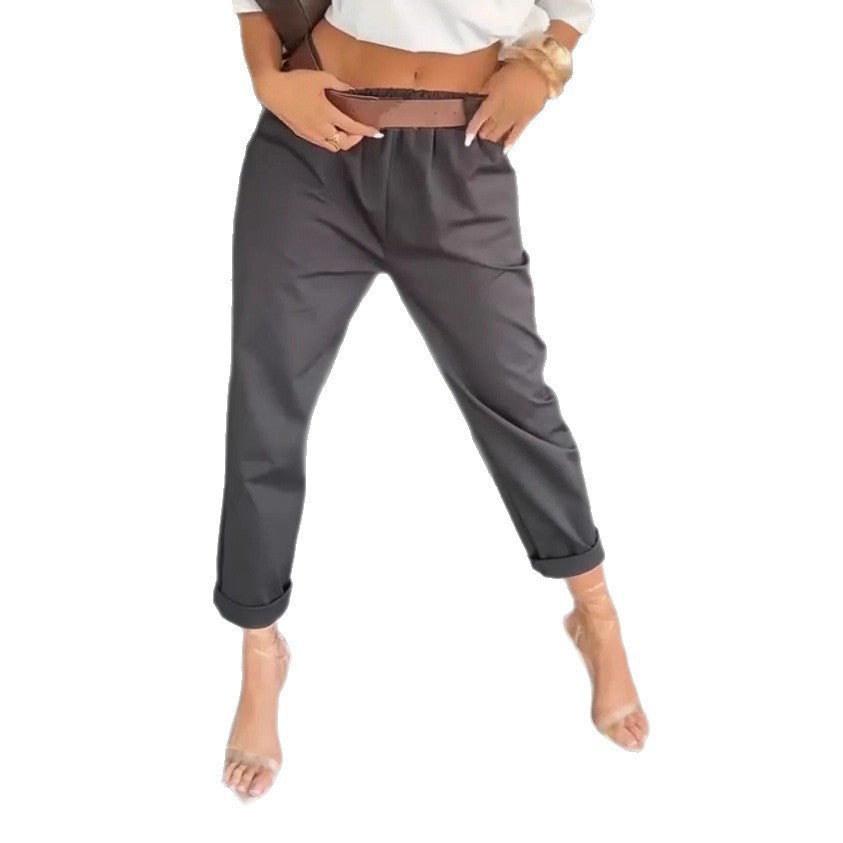 Women's high-waisted paperbag pants with gathered waistband, side pockets, and rolled hem StylebySassy