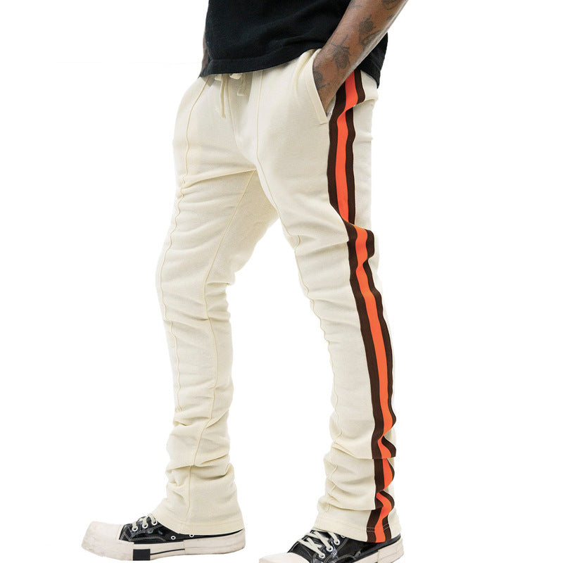 Men's slim-fit casual pants with drawstring, decorative seams, and side contrast stripe StylebySassy