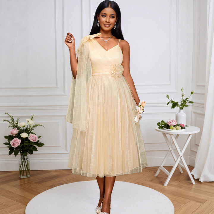 Women's glamorous cocktail dress with voluminous overlay and floral accents StylebySassy