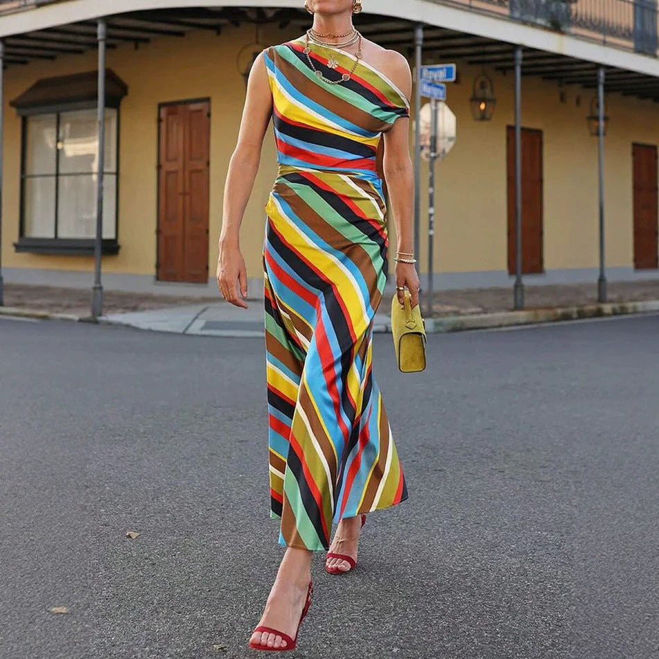 Women's asymmetrical off-shoulder maxi dress with diagonal stripe pattern and fitted silhouette StylebySassy