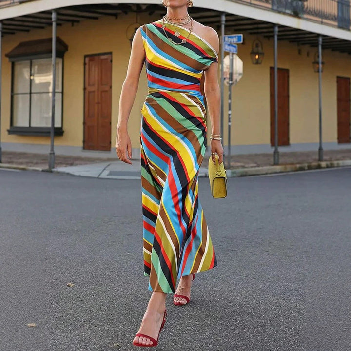 Women's asymmetrical off-shoulder maxi dress with diagonal stripe pattern and fitted silhouette StylebySassy