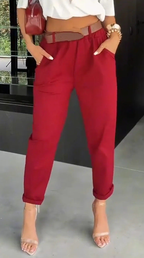 Women's high-waisted paperbag pants with gathered waistband, side pockets, and rolled hem StylebySassy