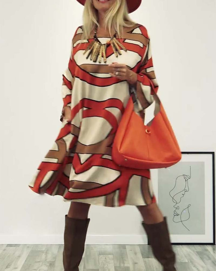 Women's generous swing dress with wide tulip hem, batwing sleeves and graphic all-over pattern StylebySassy
