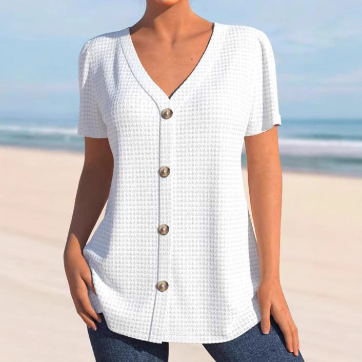 Women's finely structured V-neck top with decorative button placket and slightly flared silhouette StylebySassy