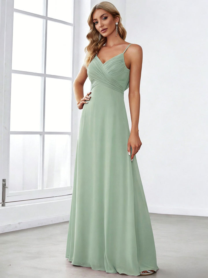 Ladies flowing chiffon evening dress with crossed draping, empire waist and fine spaghetti straps StylebySassy