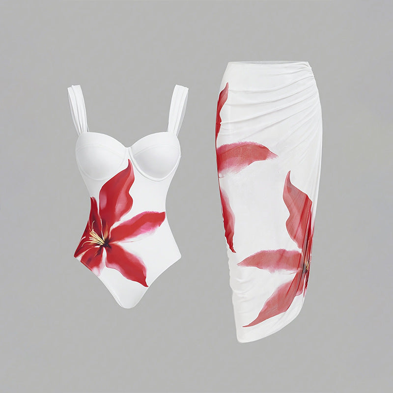 Women's one-piece swimsuit with elegant flower appliqué and draped skirt StylebySassy
