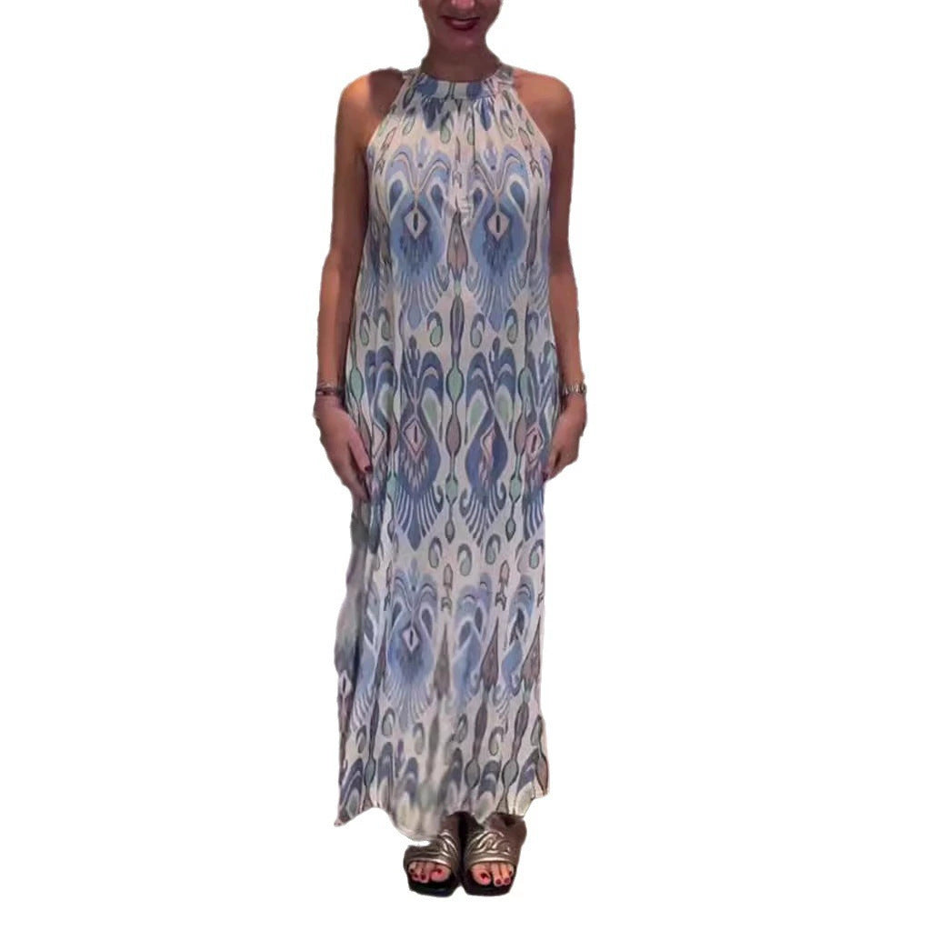 Women's flowing maxi dress with halter neck, ornamental ikat print and wide fall StylebySassy