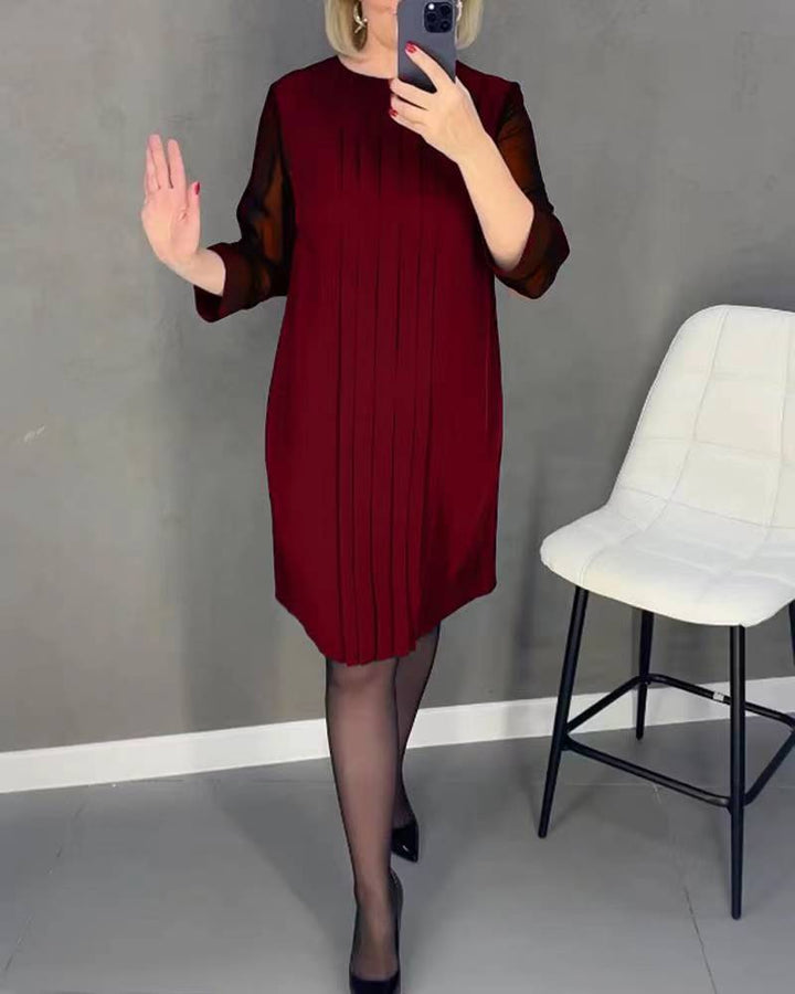 Ladies nan pleated sheath dress with knee-length silhouette and transparent three-quarter sleeves StylebySassy