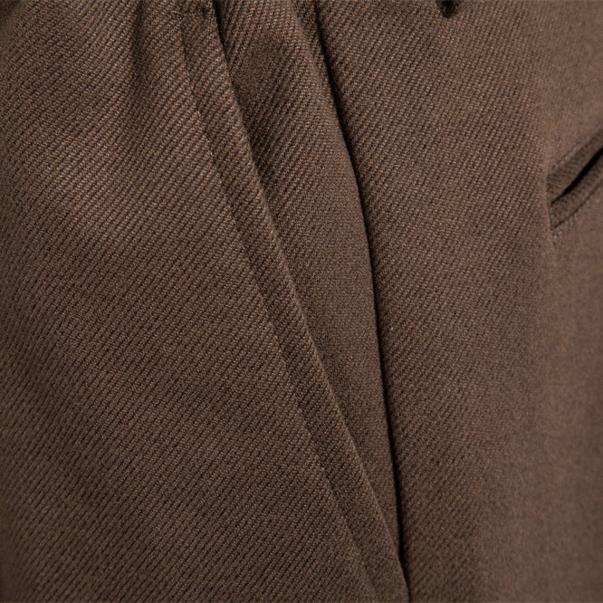 Men's pleated jogger-style trousers with drawstring, belt loops, and tapered cut StylebySassy