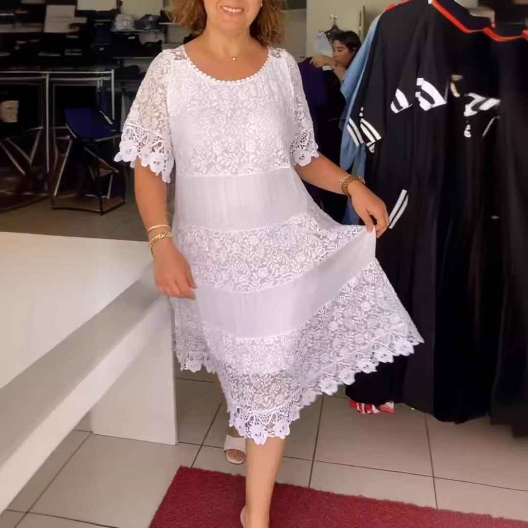 Women's midi dress with lace tiers, pleated inserts and short trumpet sleeves StylebySassy