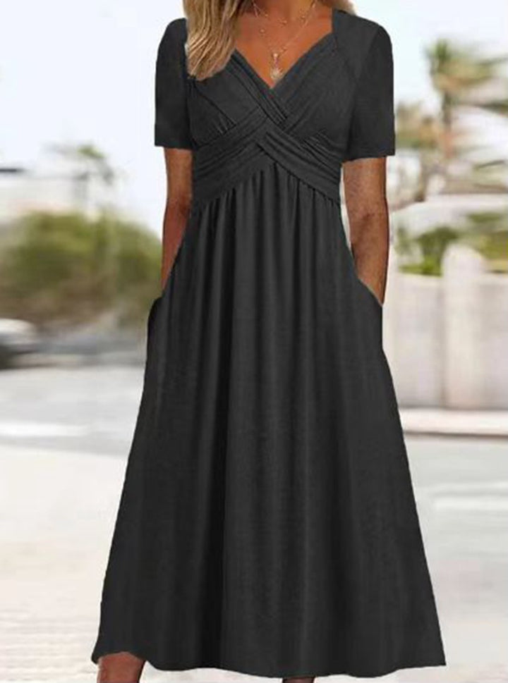 Women's airy V-neck midi dress with crossed bodice, short sleeves, and side pockets StylebySassy