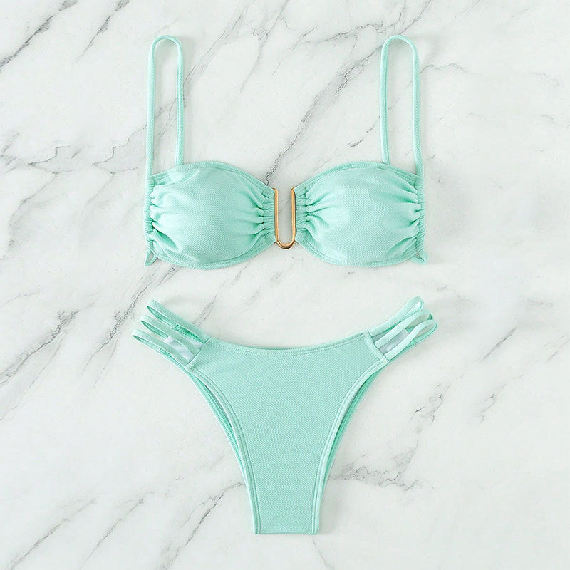 Women's bikini set with modern ruffle details and elegant golden accent StylebySassy