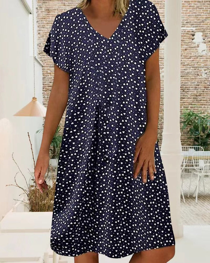 Ladies nan locker falling V-neck short dress with A-line cut, cap sleeves and all-over heart print StylebySassy