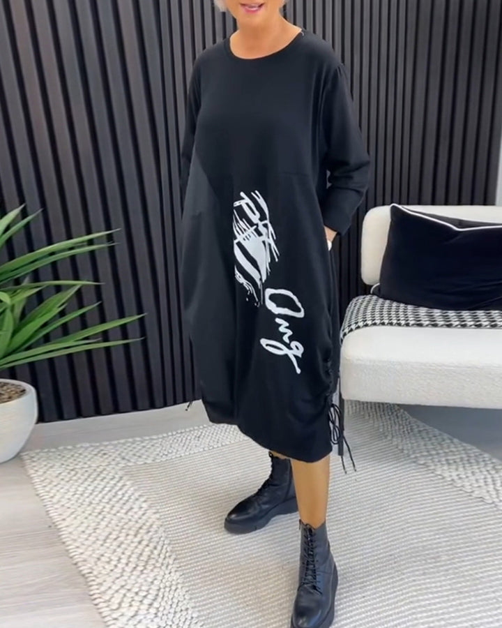 Women's casual jersey dress with side drawstring gathering, patch pockets and statement print StylebySassy