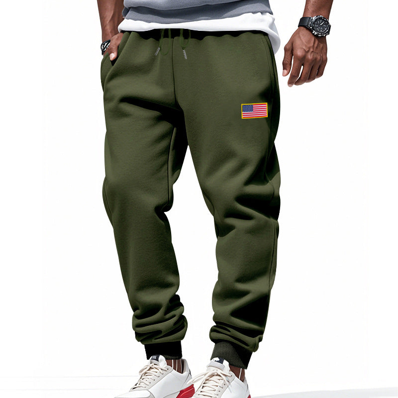 Men's slim-fit sweatpants with tapered leg, elastic drawstring waistband, and discreet flag application StylebySassy
