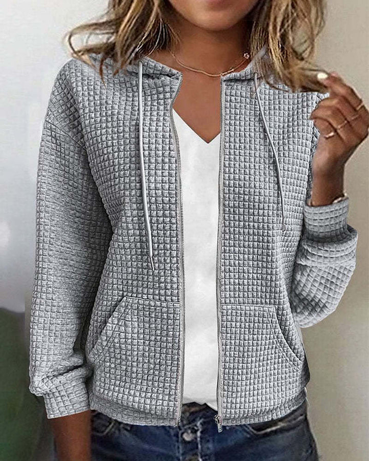 Women's quilted hooded jacket with waffle texture, full zip and kangaroo pockets StylebySassy