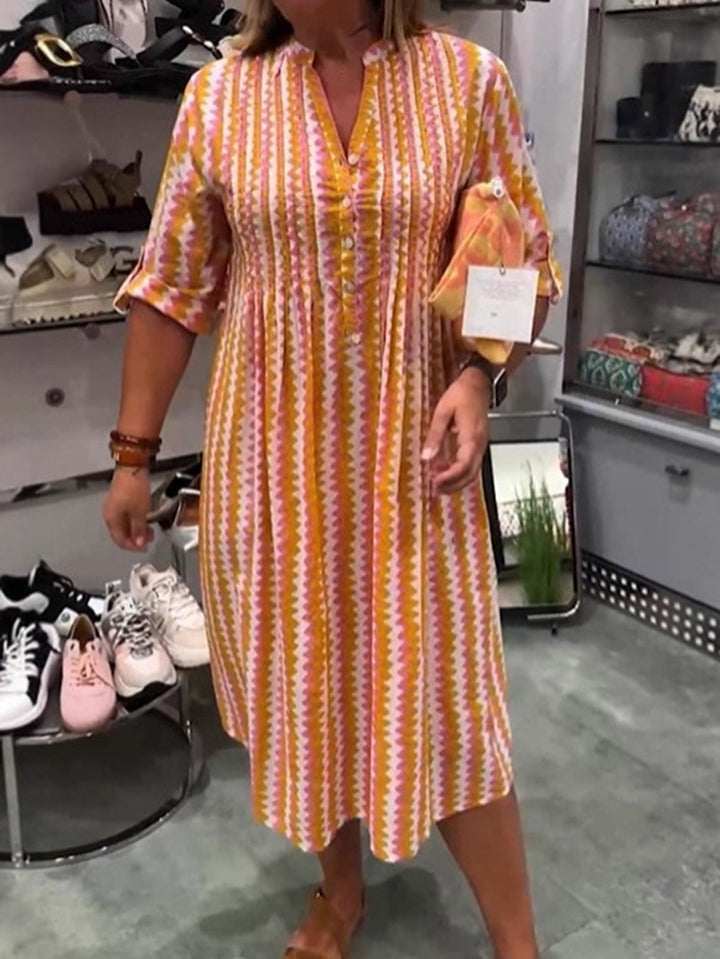 Ladies nan midi dress with underbust seam, V-neck, button placket and roll-up three-quarter sleeves StylebySassy