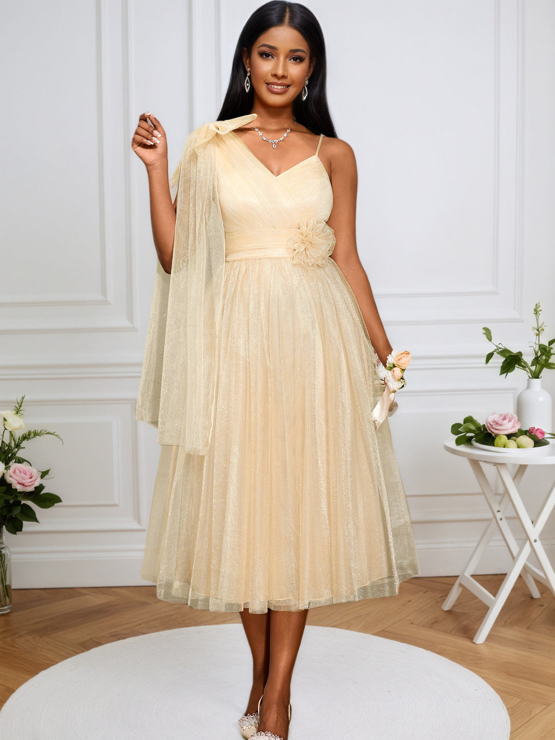 Women's glamorous cocktail dress with voluminous overlay and floral accents StylebySassy