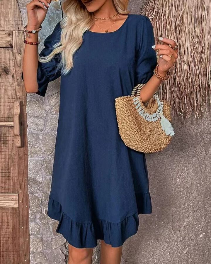 Women's lightweight A-line dress with ruffle hem and three-quarter sleeves made of linen blend StylebySassy