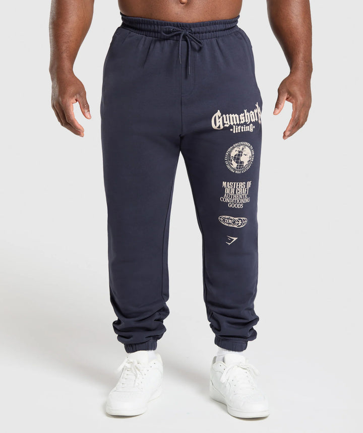 Men's tapered cotton fleece sweatpants with an elastic drawstring waistband, ribbed leg openings, and large logo print StylebySassy