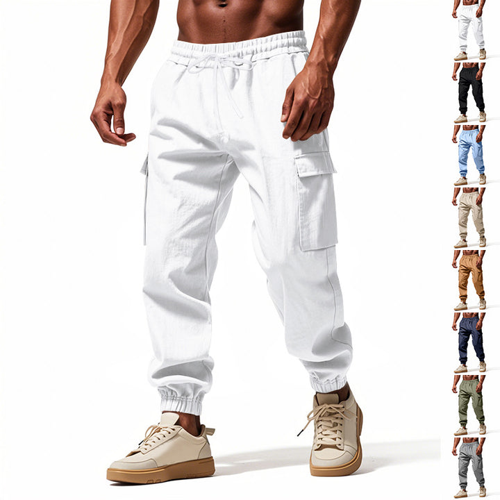 Men's tapered joggers in utilitarian style with elastic waistband, drawstring, and flap pockets StylebySassy