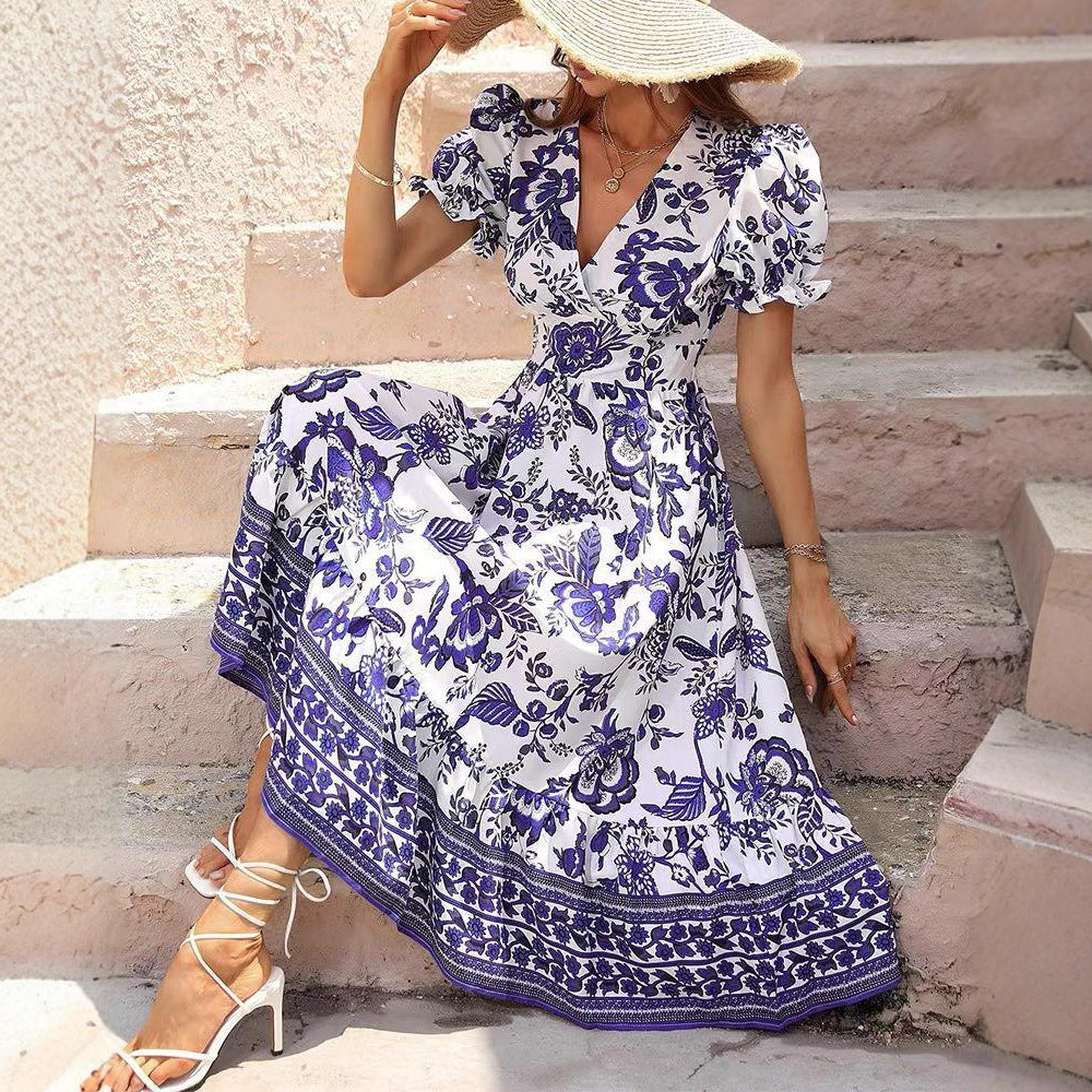 Women’s boho-inspired maxi dress with gathered empire waist, short puff sleeves, and decorative border print StylebySassy